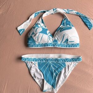 Trina Turk bikini top is size D cup and bottom is size 4